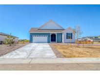 Charming single-Gathering home with a well-manicured lawn and inviting curb appeal at 680 Tubman Dr, Elizabeth, CO 80107