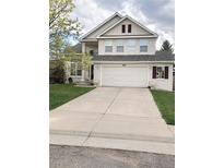 Charming two-story home featuring a spacious two car garage, landscaped yard, and inviting curb appeal at 8769 S Dudley St, Littleton, CO 80128