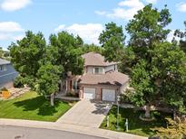 Beautiful two-story brick home with a three car garage and mature landscaping at 3043 W 109Th Pl, Westminster, CO 80031