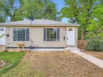 Charming home with a welcoming front porch and well-maintained landscaping at 3304 W 3Rd Ave, Denver, CO 80219