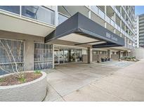 Inviting building entrance with covered walkway and glass doors to welcome residents and guests at 888 N Logan St # 4A, Denver, CO 80203