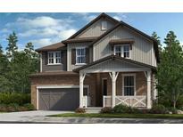 Charming two-story home with stone and siding exterior, covered porch, and well-manicured lawn at 15468 Kearney St, Brighton, CO 80602