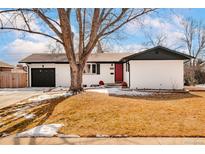 Charming single Gathering home with a well-maintained yard, red front door and one car garage at 966 S Johnson St, Lakewood, CO 80226