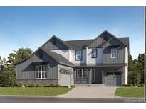 New construction home boasts modern architectural design, a manicured lawn, and a two-car garage at 595 Twilight St, Erie, CO 80516