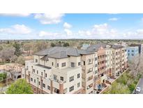 Beautiful exterior of a multi-story condo building with landscaped surroundings on a sunny day at 2200 S University Blvd # 514, Denver, CO 80210