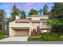 Stunning two-story home boasting a red front door, a two-car garage, and beautiful landscaping at 929 Coneflower Dr, Golden, CO 80401