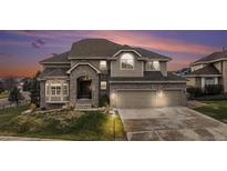 Stunning two-story home with a three-car garage and beautiful brick and siding exterior at 6911 Chestnut Ct, Parker, CO 80134