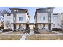 Modern townhome showcasing a contemporary design with a walkway and landscaping at 2110 Decatur St, Denver, CO 80211