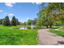 Scenic pond view with a fountain and the building in the background at 13626 E Bates Ave # 110, Aurora, CO 80014