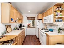 Efficient kitchen with light wood cabinets, modern appliances and cozy breakfast nook at 100 Now Colorado Ct # D1, Breckenridge, CO 80424