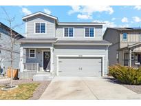 Charming two-story home with a well-maintained front yard and a two-car garage at 3344 Evening Pl, Castle Rock, CO 80109