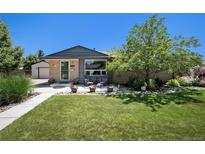 Charming single-story home with a well-maintained front lawn and landscaping at 6868 S Birch Way, Centennial, CO 80122