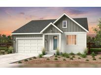 Charming single-story home featuring a two-car garage and a welcoming front porch at 4316 Ridgewalk Pt, Arvada, CO 80007