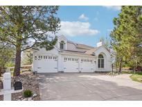 Stunning home featuring a three-car garage and well-maintained landscaping at 742 Norwich Ct, Castle Pines, CO 80108
