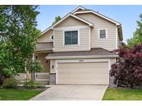 Charming two-story home with a well-maintained lawn and attached two-car garage at 4674 Winona Pl, Broomfield, CO 80020