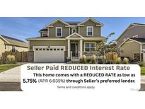 Charming two-story home with a well-manicured lawn, covered porch, and attached two-car garage at 16308 Saint Paul St, Thornton, CO 80602