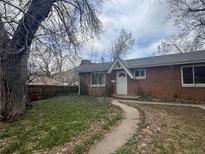 Charming single-story brick home with a well-maintained yard and inviting entryway at 2109 Jackson St, Golden, CO 80401