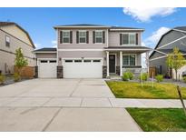 Charming two-story home with a three car garage, landscaped yard and a welcoming front porch at 17311 Rose Mallow St, Parker, CO 80134