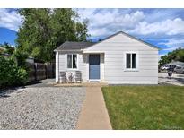 Charming single-story home featuring a well-maintained lawn and inviting front sitting area at 5525 Pierce Ct, Arvada, CO 80002