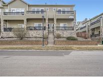 Beautiful townhouse with stone accents, private balconies, and well-maintained landscaping at 11250 Florence St # 20B, Commerce City, CO 80640