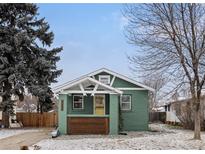 Charming bungalow with a cozy front porch and well-maintained yard at 1777 Spruce St, Denver, CO 80220