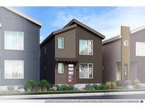 Charming two-story home with modern design, neat landscaping and a red door at 1569 W 166Th Ave, Broomfield, CO 80023