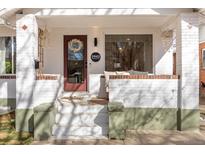 Charming front porch with a cozy sitting area and decorative details, welcoming guests to the home at 3942 Alcott St, Denver, CO 80211