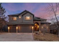 Stunning two-story home with a gray exterior and three-car garage at 19064 Eagle Ridge Dr, Golden, CO 80401