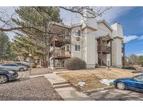 Two-story condo building with parking and walkway at 17453 E Mansfield Ave # 101El, Aurora, CO 80013