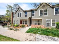 Charming townhome with landscaped front yard and inviting facade under a bright sky at 1150 Inca St # 25, Denver, CO 80204