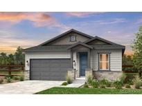 Charming single-story home featuring a two-car garage, complemented by a well-manicured lawn and inviting facade at 16975 W 92Nd Loop, Arvada, CO 80007