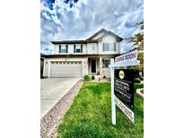 Charming two-story home featuring a spacious two-car garage and well-manicured front lawn, with a 'Coming Soon' sign displayed at 6387 Agave Ave, Castle Rock, CO 80108