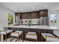 Modern kitchen with stainless steel appliances and island at 5088 E Donald Ave, Denver, CO 80222