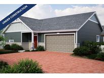 Charming one story home featuring an attached two car garage and a brick paver driveway at 21897 E 51St Dr, Aurora, CO 80019