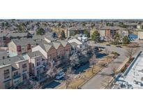 Aerial view of townhomes with a view of the city skyline at 13640 E Iliff Pl, Aurora, CO 80014