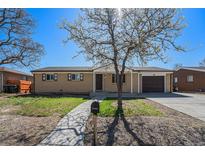 Charming single-story home with a well-manicured front yard and an attached one-car garage at 11674 Claude Ct, Northglenn, CO 80233