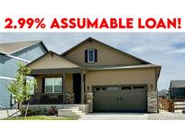 Charming single-Gathering home featuring a well-manicured lawn and a two-car garage, offered with an assumable loan at 222 Fox St, Bennett, CO 80102