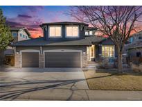 Charming two-story home with a two-car garage, landscaped yard, and inviting front porch, perfect for comfortable living at 2816 Greensborough Dr, Highlands Ranch, CO 80129
