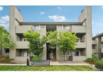 Multi-story condo building featuring well-maintained grounds and a welcoming entrance at 3100 S Federal Blvd # 232, Denver, CO 80236