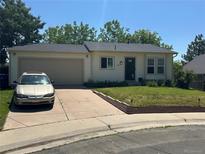 Charming single-story home with attached garage, well-kept lawn, and inviting curb appeal at 19645 E Buchanan Pl, Aurora, CO 80011