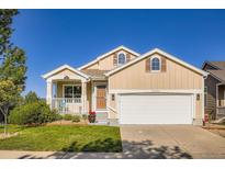 Charming single-Gathering home with well-maintained lawn and inviting front porch at 5191 S Nepal Way, Centennial, CO 80015
