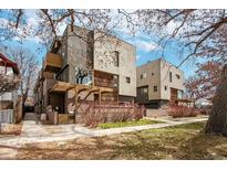Modern two-story home with unique architectural details and a well-maintained front yard at 1632 N Gilpin St, Denver, CO 80218