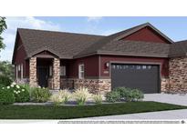 Charming home boasts stone accents, a covered porch, and a two-car garage, enhancing its curb appeal at 900 W 128Th Pl, Westminster, CO 80234