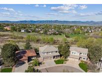 Beautiful Denver neighborhood with attractive two-story homes and mountain views in the distance at 9531 Desert Willow Way, Highlands Ranch, CO 80129