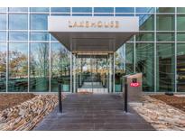Modern condo building featuring floor-to-ceiling windows and sleek architectural details at main entrance at 4200 W 17Th Ave # 508, Denver, CO 80204