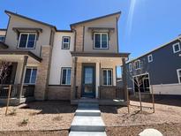 Charming two-story home featuring a stylish modern design and a welcoming front porch at 6658 N Nepal Ct, Aurora, CO 80019