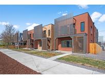 Modern townhomes showcasing clean lines and attractive exterior design with vertical slat accents at 3285 Lawrence St, Denver, CO 80205