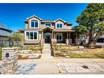 Beautiful two-story home with stone accents, landscaped yard, and inviting front porch, a great curb appeal at 789 Zamia Ave, Boulder, CO 80304