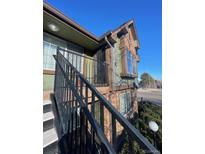 Multi-level home boasting unique architectural details and beautiful window accents at 61 S Sable Blvd # C26, Aurora, CO 80012