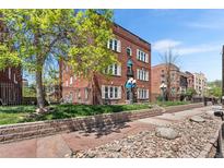 Charming brick building with well-maintained landscaping and a welcoming entrance at 1351 N Washington St # 15, Denver, CO 80203